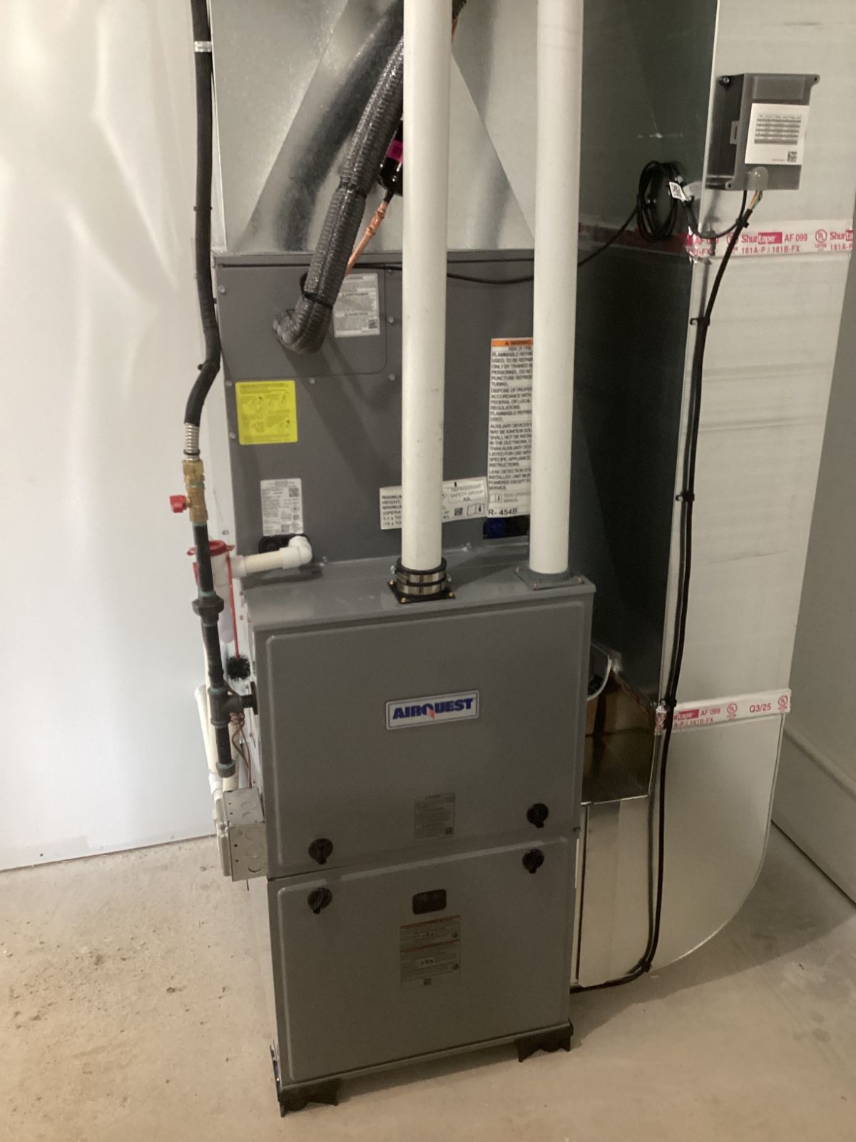Airquest furnace installed in a utility room