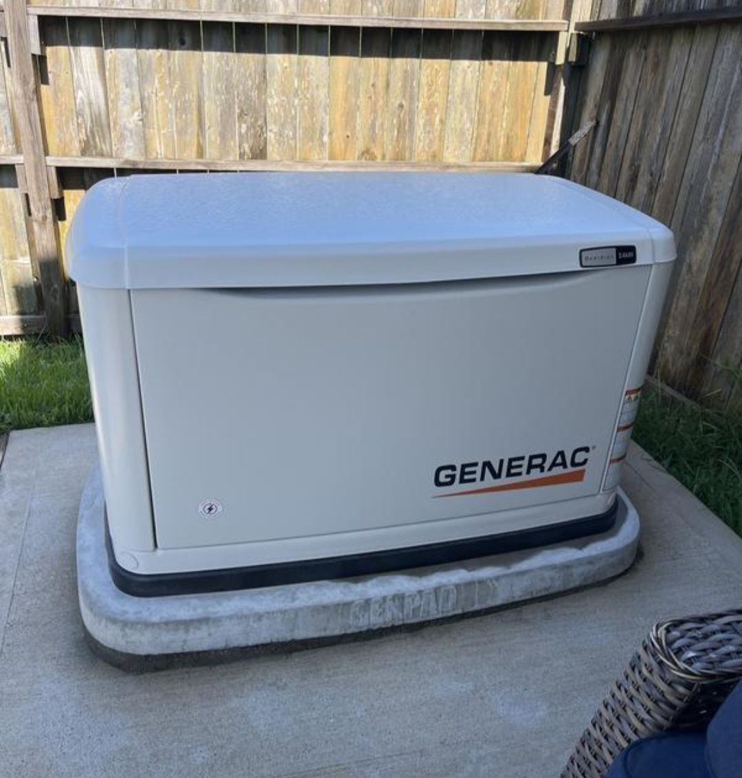 Generac standby generator installed beside a home